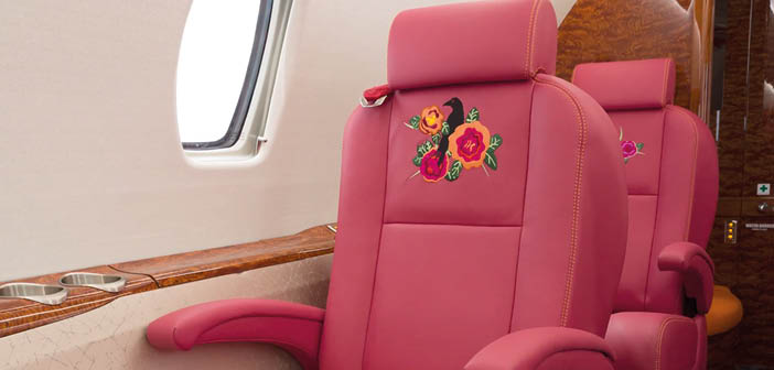 The seats were reupholstered with colourful leather and an embroidered raven detail